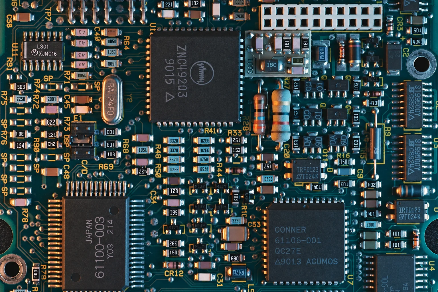 Blue circuit board with integrated circuits and copper details
